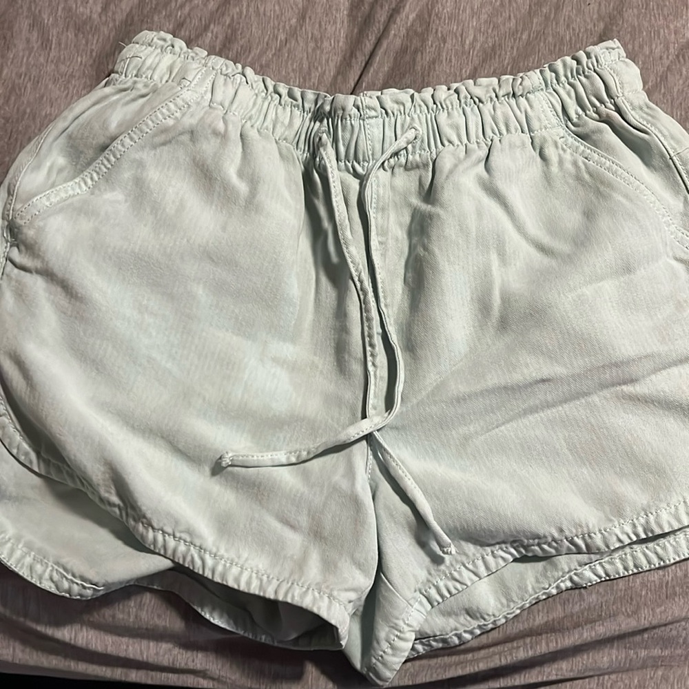 Light blue/green/teal flowy American Eagle tie shorts size small